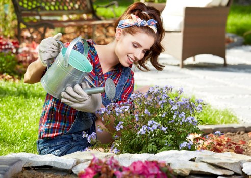 Workers following safety procedures during garden maintenance